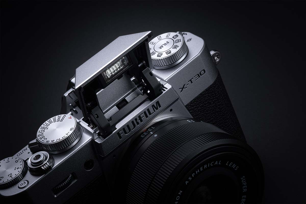 Close-up of a Fujifilm X-T30 camera on a black background