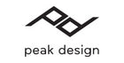 Logo of peak design with stylized letters and text.