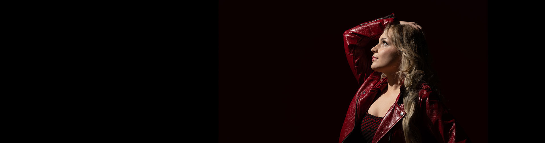 young model with a single light illuminating her