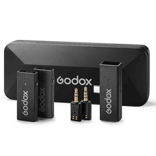 Transmitter, Receivers, Adapters, & Charge Case of the Godox Movelink MINI UC Kit 2