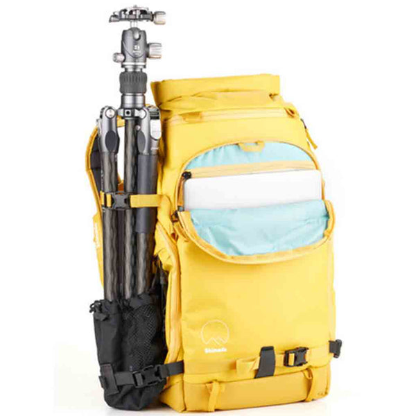 Tripod Carry Demonstration and Front Side Laptop Sleeve of the Shimoda X25 V2 Starter Kit Backpack Yellow