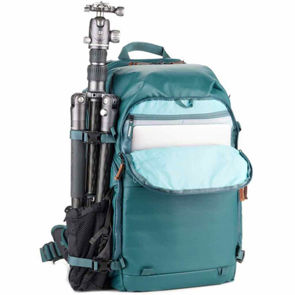 Tripod Carry Demonstration and Front Side Laptop Sleeve of the Shimoda Explore V2 Women's Starter Kit Backpack Teal