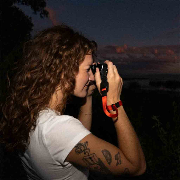 In Use Demonstration of the WANDRD Magnetic Camera Wrist Strap Red