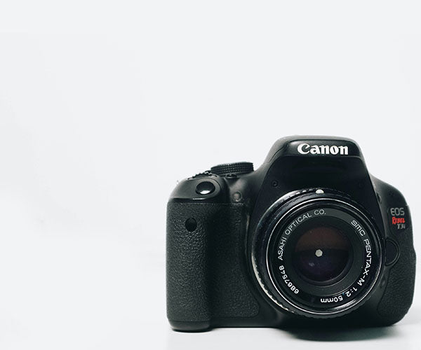 Canon DSLR camera on a white background