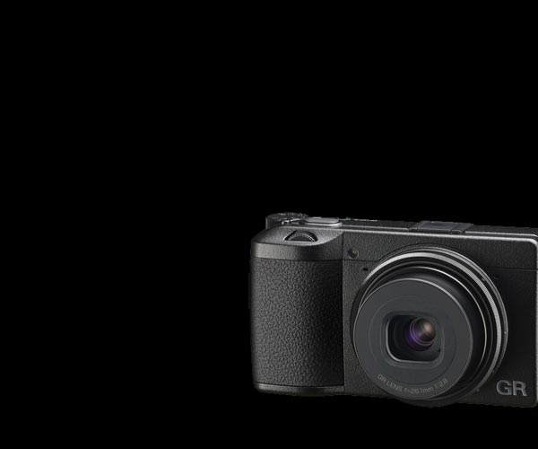 Ricoh GRIIIX black camera on a black background