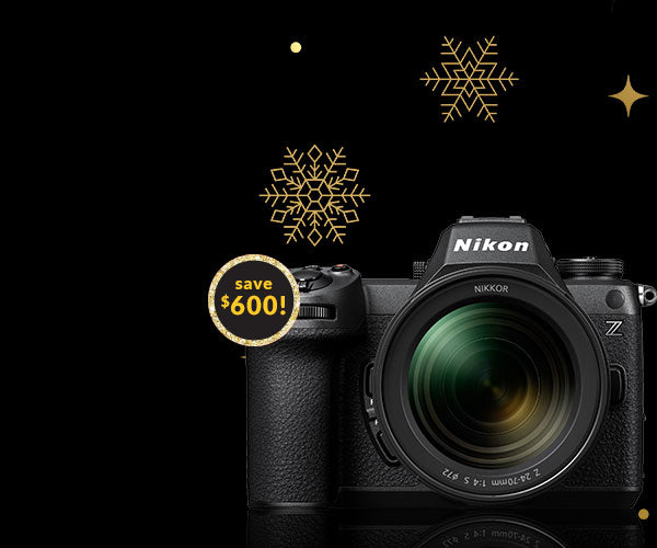 Nikon camera with snowflake graphics and a discount label on a black background