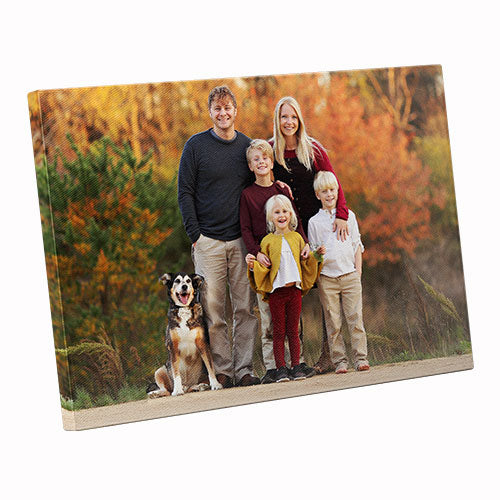 Family photo on a canvas print with a dog in an autumn setting
