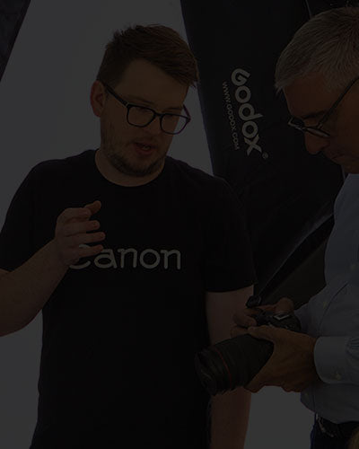 Two people discussing photography