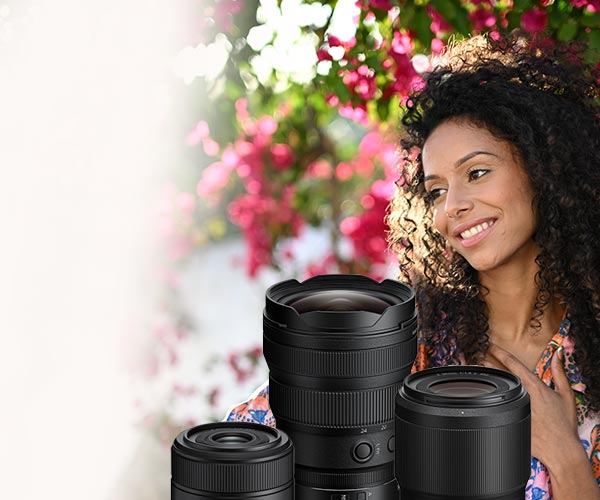 woman with three lenses with flowers in the background