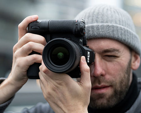 Photographer with Nikon Z5 II mirrorless camera