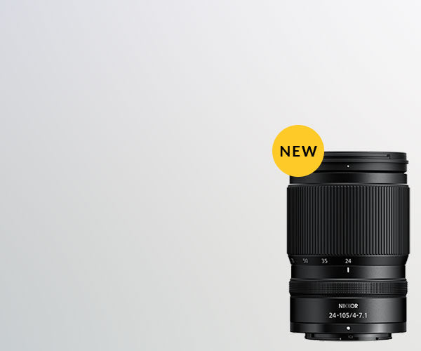 Camera lens with 'NEW' label on a light gray background