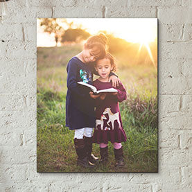 Presentation print of two sisters reading a book