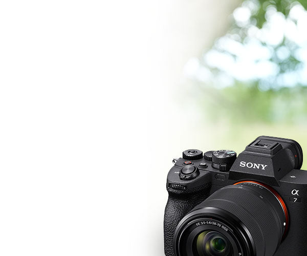Sony camera with lens on a blurred natural background
