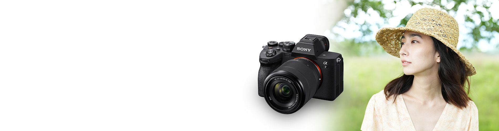 Sony camera with a woman in a hat and dress in a natural setting