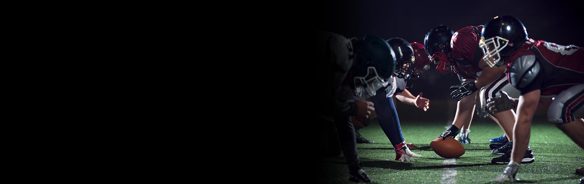 football players at the line of scrimmage