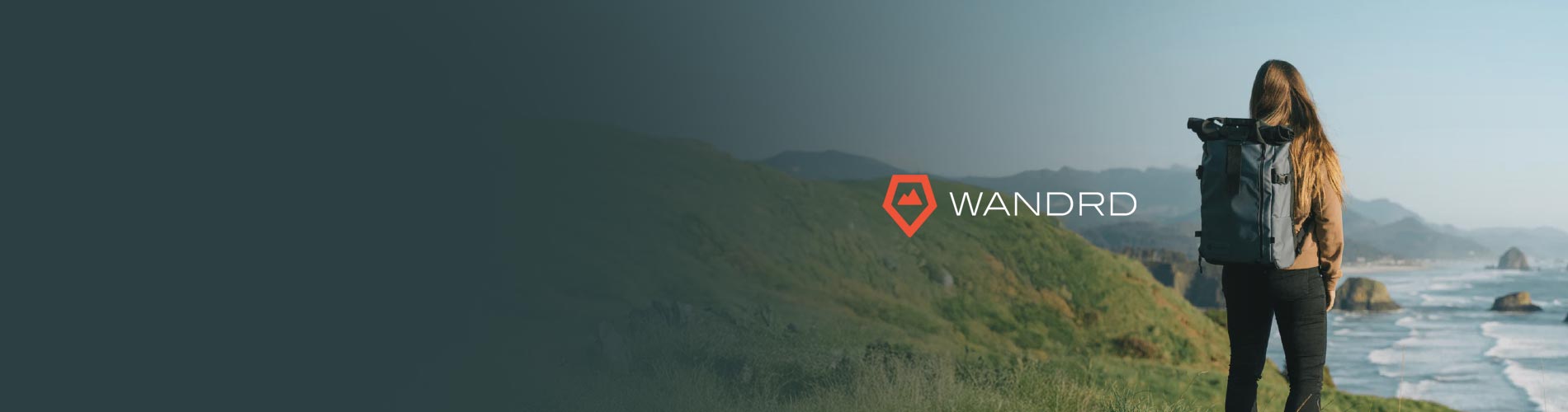 Wandrd logo with female carrying a Wandrd PRVKE Bag on her back