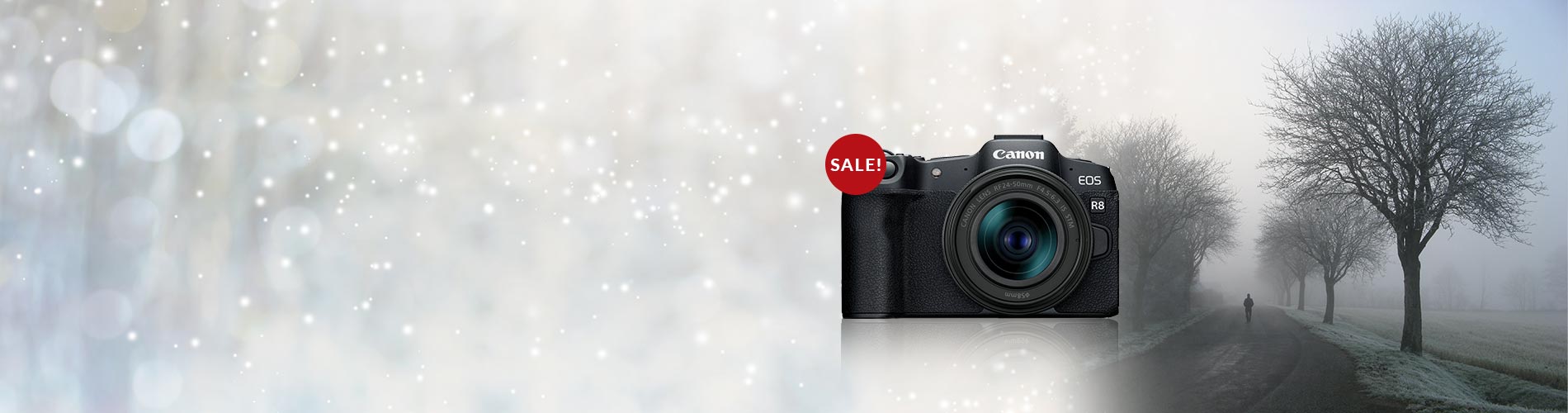 Camera with a 'SALE!' tag on a blurred winter landscape background