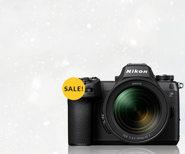 Nikon camera with a 'SALE!' label on a light gray background