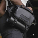 Water Bottle Carry Demonstration of the Wandrd Roam 3L Sling Black