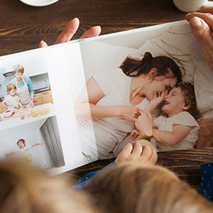 open photobook of a child and their mother
